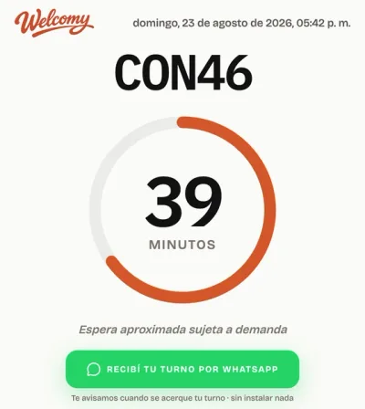 La pantalla real del turno de un visitante: su número, la espera estimada y el aviso por WhatsApp.